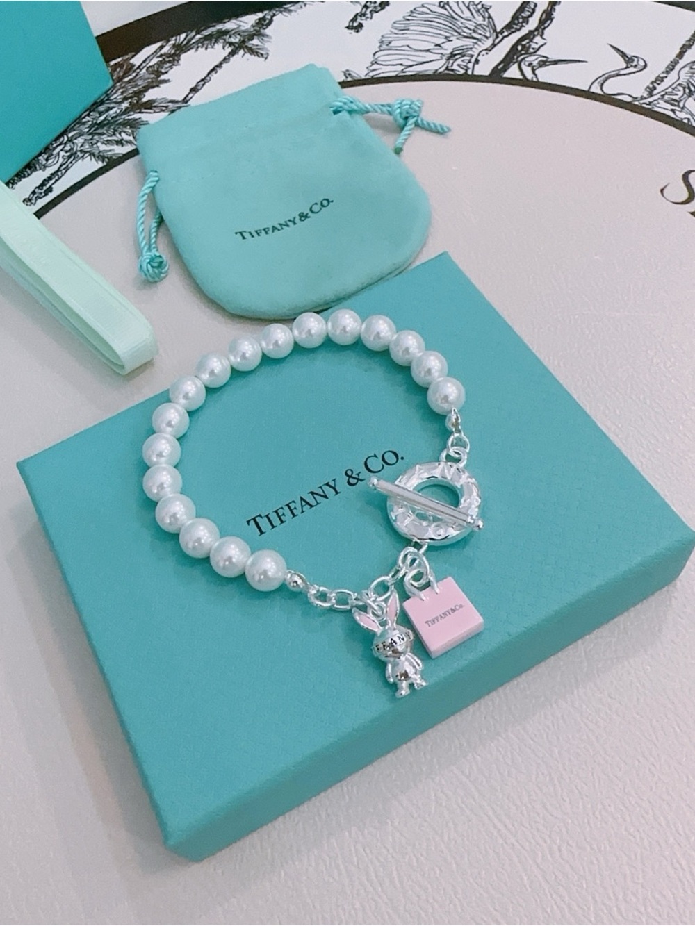Tiffany & Co. Pearl Bead Bracelet with Silver Charms and Pink Tag